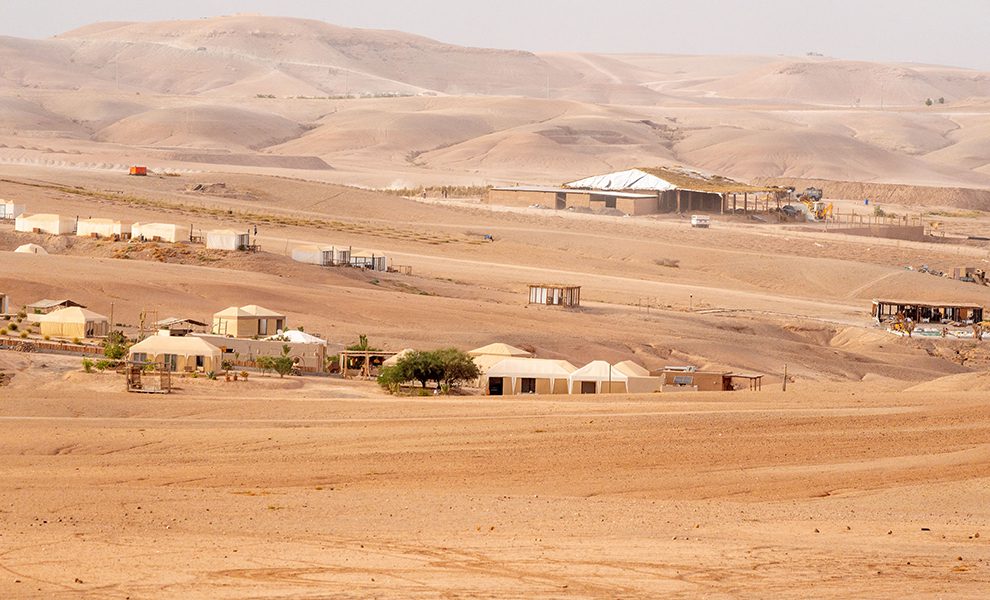 Desert Camp Tents Set Against Agafay’s Arid Terrain
